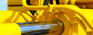 A close up of the side of a yellow machine.