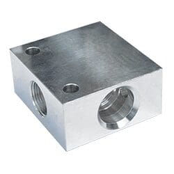 Metallic block with threaded holes.